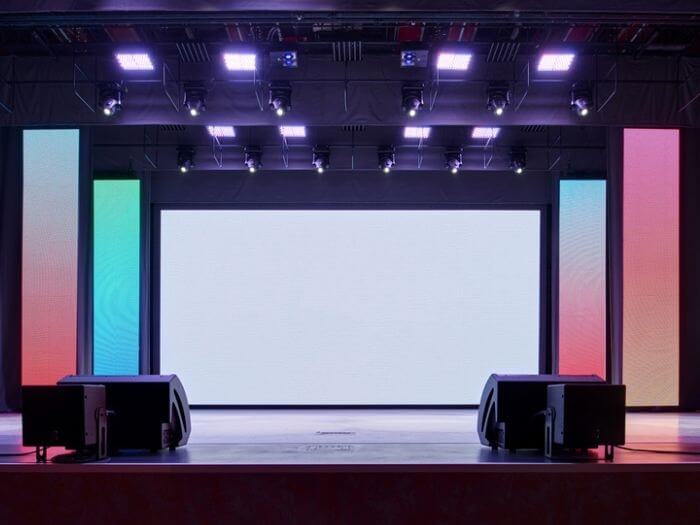 Interior of a bright and colourful conference room with empty stage..
