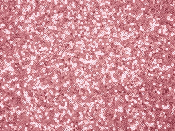 Pink glittering sequins sewn onto fabric
