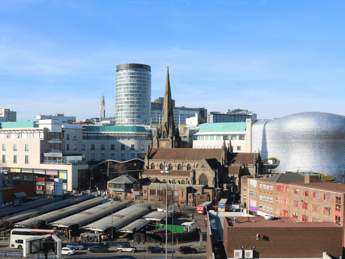 Birmingham UK Skyline. Market, St Martins Church, Rotunder and The Bullring.