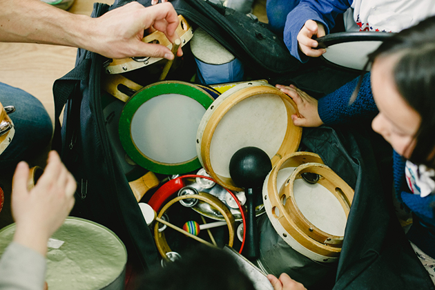 A selection of percussion being used in a children's music lesson