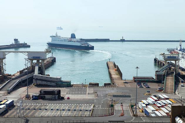Photograph of a ship leaving a port at Dover.