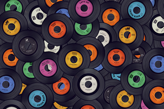 Photograph of a stack of different multi coloured records