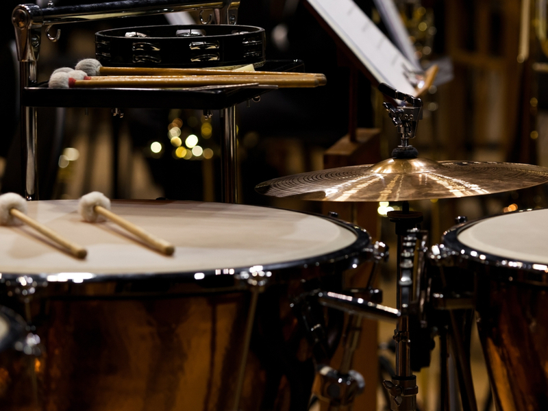 Photograph of percussive instruments set up in an orchestral setting.